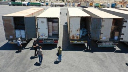 epa10095448 An aerial view taken with a drone shows trucks carrying aid material after crossing the ... epa10095448 An aerial view taken with a drone shows trucks carrying aid material after crossing the ...