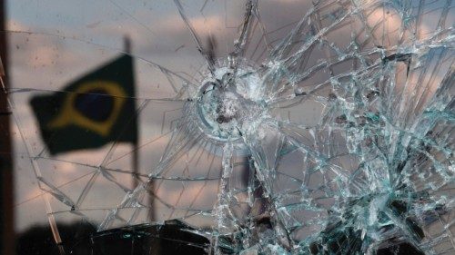 A Brazilian flag is reflected on a broken window of the Supreme Court building in Brasilia on ... A Brazilian flag is reflected on a broken window of the Supreme Court building in Brasilia on ...