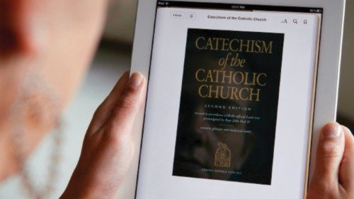 A woman displays the e-book version of the Catechism of the Catholic Church on an iPad in Washington ...