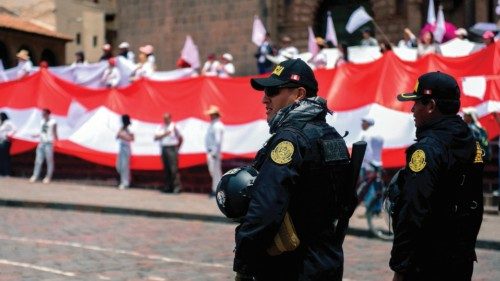 Riot police stand guard athe Plaza de Armas in Cusco, Peru on January 15, 2023, as residents carry ... Riot police stand guard athe Plaza de Armas in Cusco, Peru on January 15, 2023, as residents carry ...