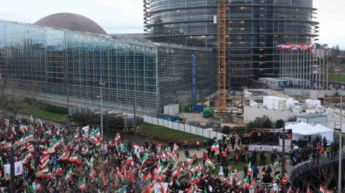 People take part in a rally against the Iranian regime in front of the European Parliament in ...