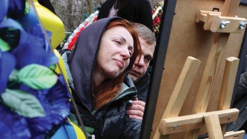 epa10411321 Relatives and friends react during a funeral ceremony for Mykhailo Korenovsky, a boxing ...