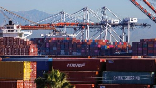 FILE PHOTO: Stacked containers are shown as ships unload their cargo at the Port of Los Angeles in ...