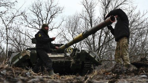 Ukrainian service members check a tank barrel during offensive and assault drills, amid Russia's ... Ukrainian service members check a tank barrel during offensive and assault drills, amid Russia's ...