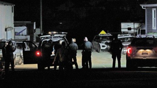 epa10426041 Half Moon Bay Police gather at one of two mass shootings sites at a farms Half Moon Bay, ...