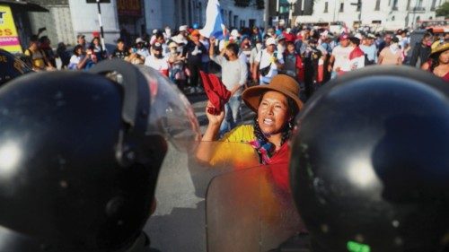 Demonstrators face riot police amid anti-government protests after Peru's former President Pedro ...