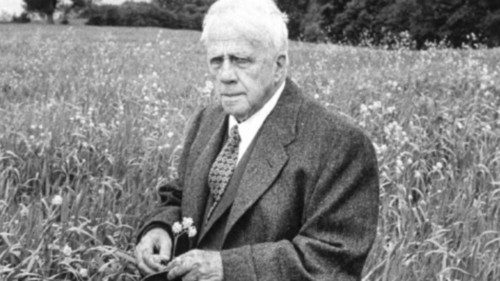 American poet, Robert Frost standing in meadow during visit to the Gloucester area of England where ...