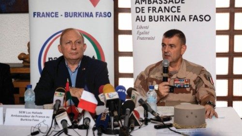 (FILES) In this file photo taken on July 21, 2022 Luc Hallade (L), French ambassador to Burkina ...
