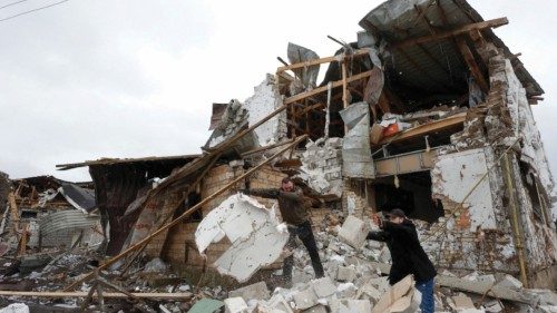Local residents remove debris from a house of their neighbour damaged by a Russian military strike, ... Local residents remove debris from a house of their neighbour damaged by a Russian military strike, ...