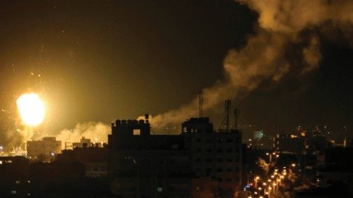 Fire and smoke rise above buildings in Gaza City as Israel launched air strikes on the Palestinian ...