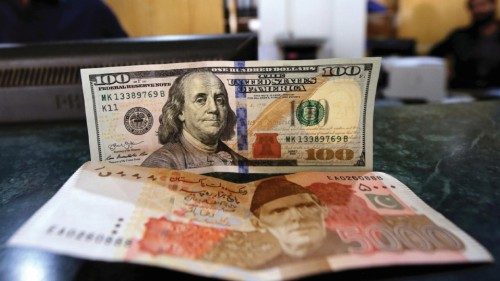 epa10433049 A currency exchange dealer sorts US dollars and Pakistani rupees at a money exchange ... epa10433049 A currency exchange dealer sorts US dollars and Pakistani rupees at a money exchange ...