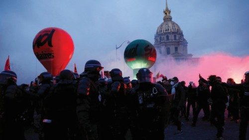 French police face off with protesters amid clashes near the Invalides during a demonstration ...