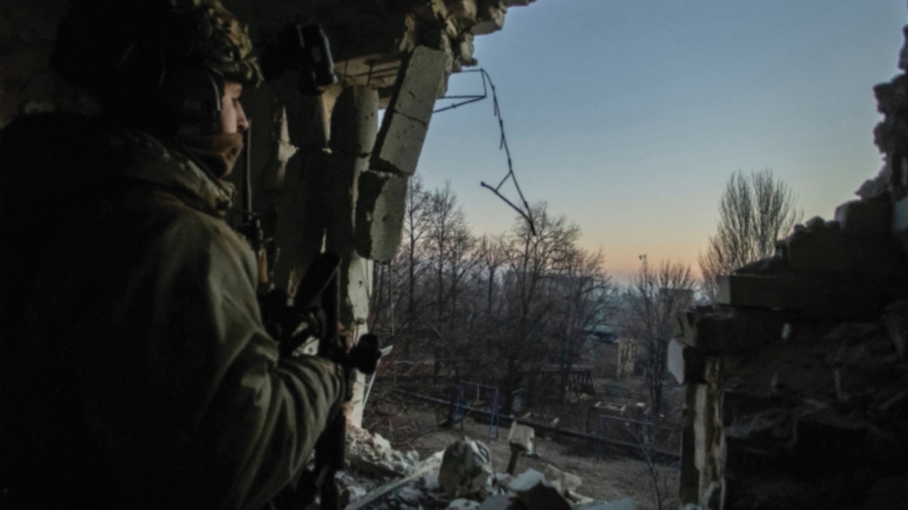 A Ukrainian serviceman looks on, amid Russia's attack on Ukraine, in Bakhmut, Donetsk region, ...
