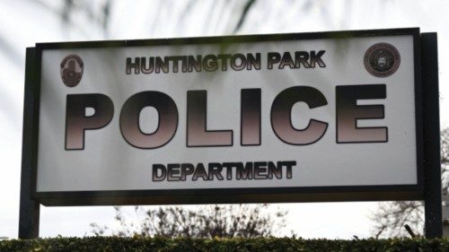 Signage is displayed outside the Huntington Park Police Department, where family and friends of ...