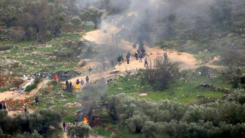 epa10445434 Palestinians burn tires during clashes after a protest against Israeli settlements at ...