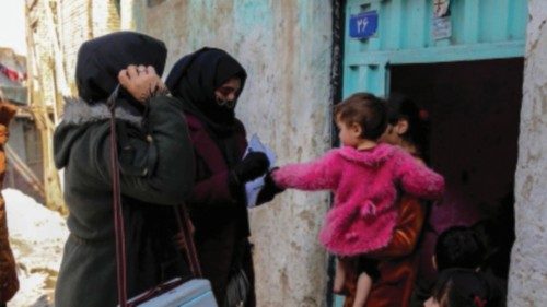 epa10428706 Health workers visit houses to administer polio vaccination to children in Kabul, ...