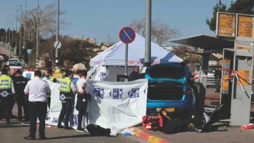 Israeli emergency responders gather at the site of a reported ramming attack in Jerusalem on ...