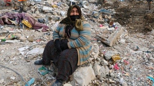A woman reacts at the site of a collapsed building as the search for survivors continues, in the ... A woman reacts at the site of a collapsed building as the search for survivors continues, in the ...