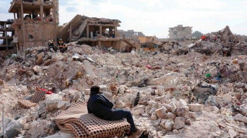 TOPSHOT - A resident rests on a salvaged mattress, as search and rescue operations continue days ... TOPSHOT - A resident rests on a salvaged mattress, as search and rescue operations continue days ...