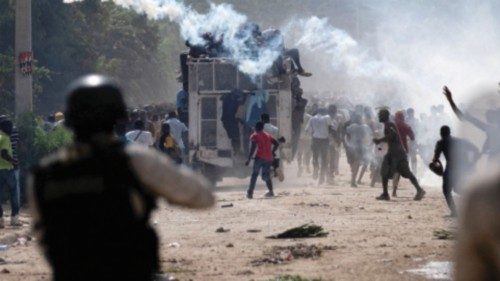 FILE PHOTO: Haitian National police officers deploy tear gas during a protest demanding the ... FILE PHOTO: Haitian National police officers deploy tear gas during a protest demanding the ...