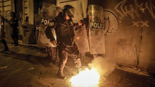 epa10458223 A policeman tries to put out a fire on a shield of the security forces, during an ... epa10458223 A policeman tries to put out a fire on a shield of the security forces, during an ...