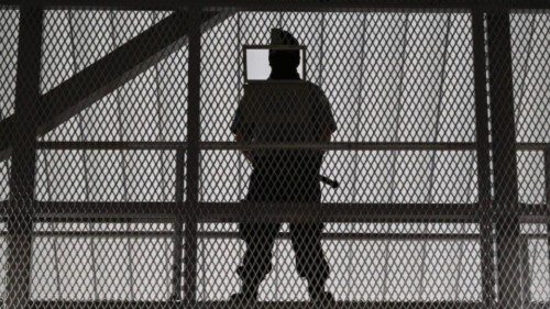A government prison security officer stands guard inside the newly inaugurated prison, at a secluded ...