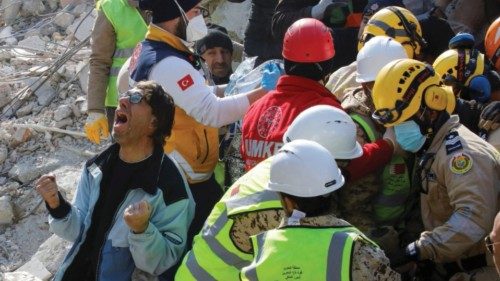 A son of a Turkish woman Saadet Sendag reacts as his mother is rescued after 177 hours, at the site ...
