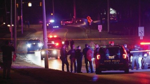 Police officers surround a scene where the suspect was located as they respond to a shooting at ... Police officers surround a scene where the suspect was located as they respond to a shooting at ...