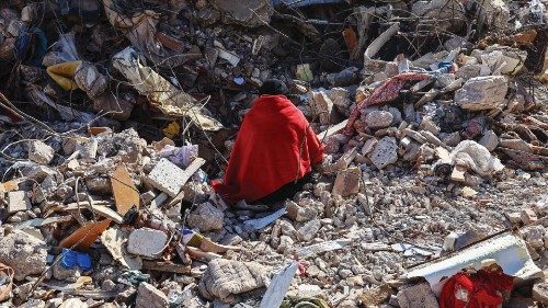 epaselect epa10467968 A woman sits on the rubble of her home waiting for bodies of her family ...