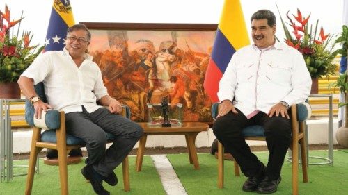 Colombian President Gustavo Petro and Venezuelan President Nicolas Maduro react during a meeting for ...