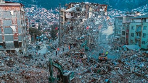 TOPSHOT - This aerial photograph taken on February 20, 2023 shows diggers removing the rubble of ... TOPSHOT - This aerial photograph taken on February 20, 2023 shows diggers removing the rubble of ...