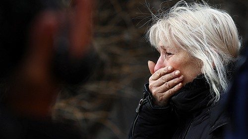 A woman reacts after a shelling near a bus station, amid Russia's attack on Ukraine, in Kherson, ...