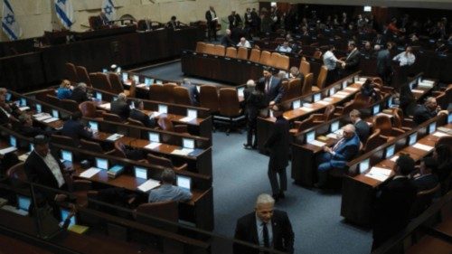 Israel's lawmaker Yair Lapid, walks in the Israel's parliament, the Knesset, as lawmakers convene ...