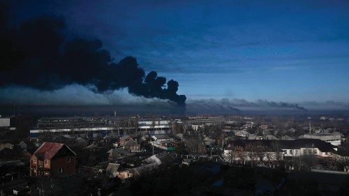 (FILES) In this file photo taken on February 24, 2022 black smoke rises from a military airport in ...