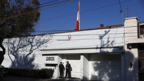 FILE PHOTO: Police officers stand outside the Embassy of Peru in Mexico City, a day after Peru's ...