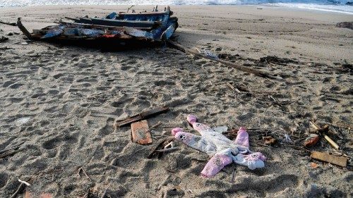 A photograph taken on February 28, 2023 shows a onesie and pieces of wodd washed up on the beach, ...