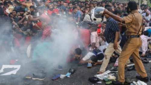 epa10492468 Protesters are crushed in a stampede in an attempt to hide from tear gas fire during an ...