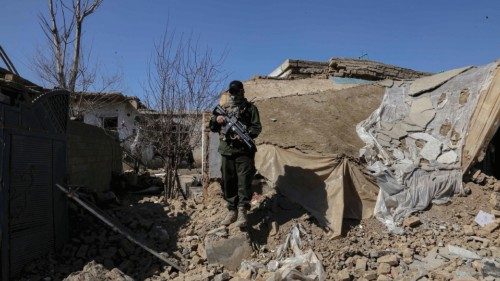 epa10493734 A Taliban inspects the scene of an operation against IS militants in Kabul, Afghanistan, ...