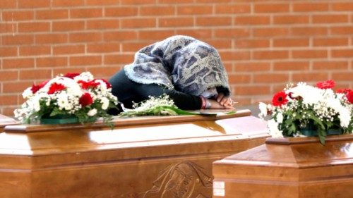 The relatives of the victims of the Steccato di Cutro shipwreck mourn over the coffins of their ...