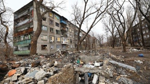 Debris is seen near a damaged residential building amid Russia's attack on Ukraine, in Chasiv Yar, ...
