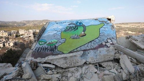 epa10490978 A view of a damaged wall of a collapsed building painted by Syrian artists in Al-Milan ...