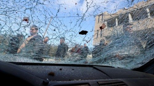 epa10511078 The cracked windshield of a heavily damaged vehicle after three Palestinians where ...