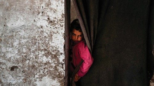A displaced Syrian child living in war-damaged buildings, are pictured in Syria's rebel-held ...