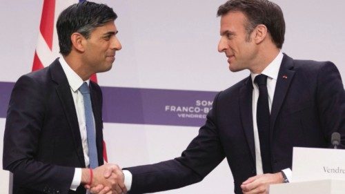 French President Emmanuel Macron and Britain's Prime Minister Rishi Sunak shake hands during a joint ...