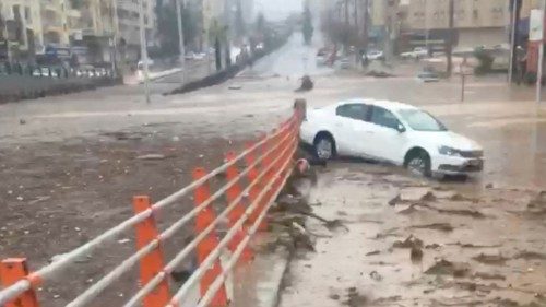 A car is seen next to the underpass that got flooded following torrential rains, in Sanliurfa, ...