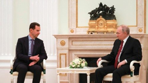 epa10524518 Russian President Vladimir Putin (R) speaks with Syrian President Bashar al-Assad (L), ...