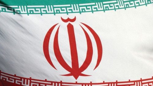 FILE PHOTO: The Iranian flag waves in front of the International Atomic Energy Agency (IAEA) ...