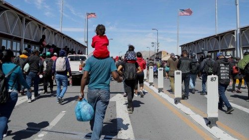 TOPSHOT - Migrants, mostly of Venezuelan origin, attempt to forcibly cross into the United States at ...