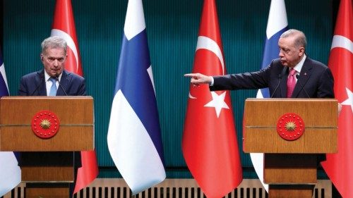 Turkish President Recep Tayyip Erdogan (R) points towards Finnish President Sauli Niinisto (L) ...