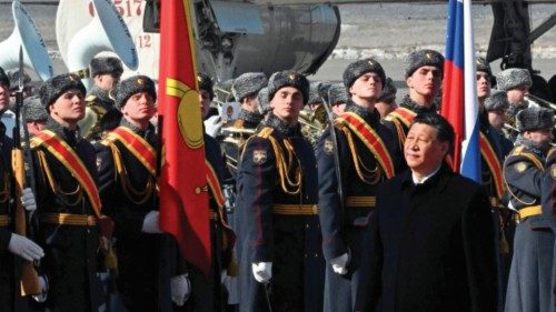 China's President Xi Jinping, accompanied by Russian Deputy Prime Minister Dmitry Chernyshenko, ...